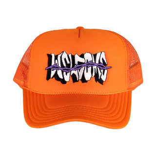 WELCOME SKATEBOARDS. ORANGE TRUCKER HAT WITH MESH BACK FOAM FRONT. SNAP CLASP. WELCOME LOGO WITH PURPLE THORNS ACROSS LOGO ON FRONT. ORANGE BRAID ALONG BILL.