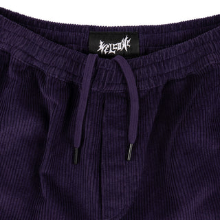 Up close view of elastic waist and drawstring with black aglet.