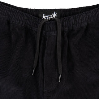 Up close view of elastic waist and drawstring with black aglets.