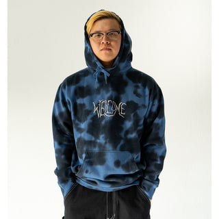 Front view of model wearing hoodie.