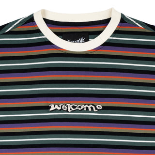 Up close view of embroidered welcome logo and crewneck.