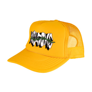 WELCOME SKATEBOARDS. GOLD TRUCKER HAT WITH MESH BACK FOAM FRONT. SNAP CLASP. WELCOME LOGO WITH GREEN THORNS ACROSS LOGO ON FRONT. GOLD BRAID ALONG BILL.