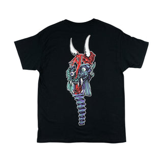 Back view of beauty tee black. large creature head with lopsided face. Baboon face hidden within nose. Horns protruding from rose and body. accordion pattern for chin. Mint/purple/red/white color palette. 