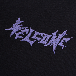 Up close view of chest welcome vampire logo in purple croc puff print.